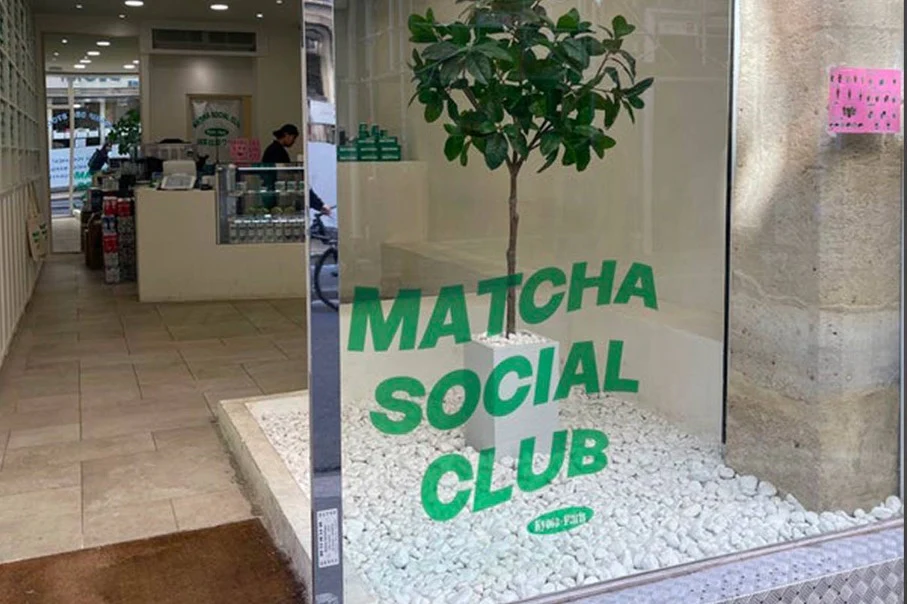 Exterior photo of a matcha store with "Matcha Social Club" written on the exterior shop window